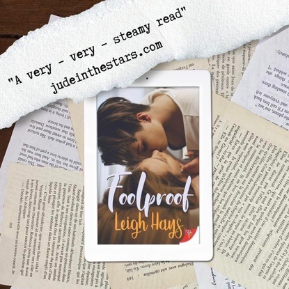 On a backdrop of book pages, an iPad with the cover of Foolproof by Leigh Hays. At the top of the image, on the left-hand side, a strip of torn paper with a quote: "A very – very – steamy read " and a url: judeinthestars.com