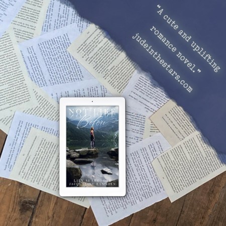 On a backdrop of book pages, an iPad with the cover of Not Like Before by Lily Seabrooke & Jacqueline Ramsden. In the top right corner of the image, a strip of torn paper with a quote: "A cute and uplifting romance novel." and a URL: judeinthestars.com.